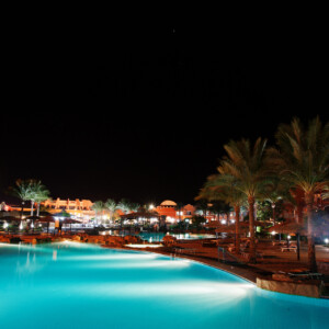 Swimming pool of a luxury tropical caribbean resort at night